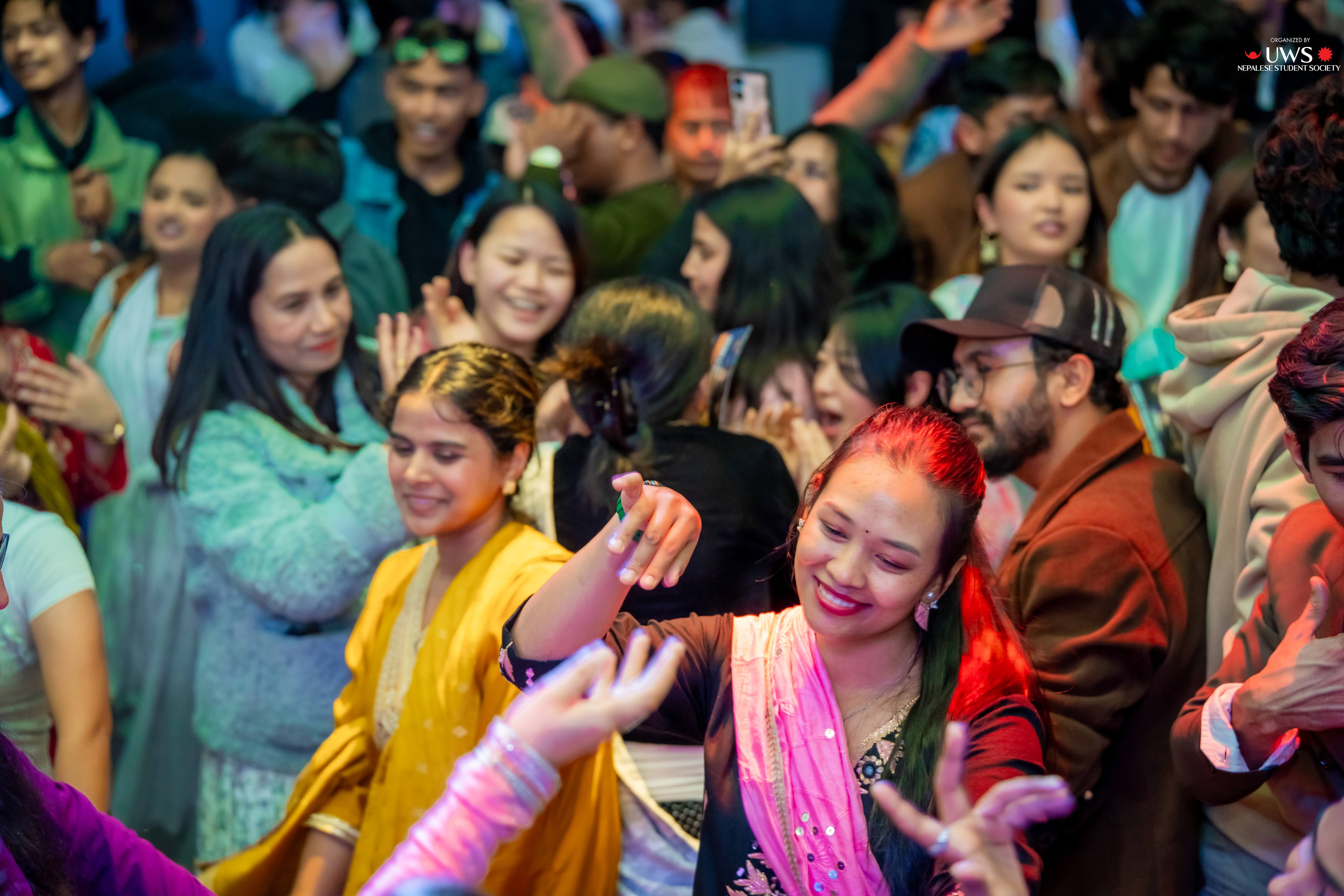Photos of UWS students dancing at the Nepalese New Year's Celebration