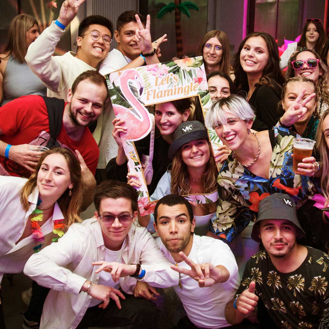 Students posing at the bar on Paisley campus