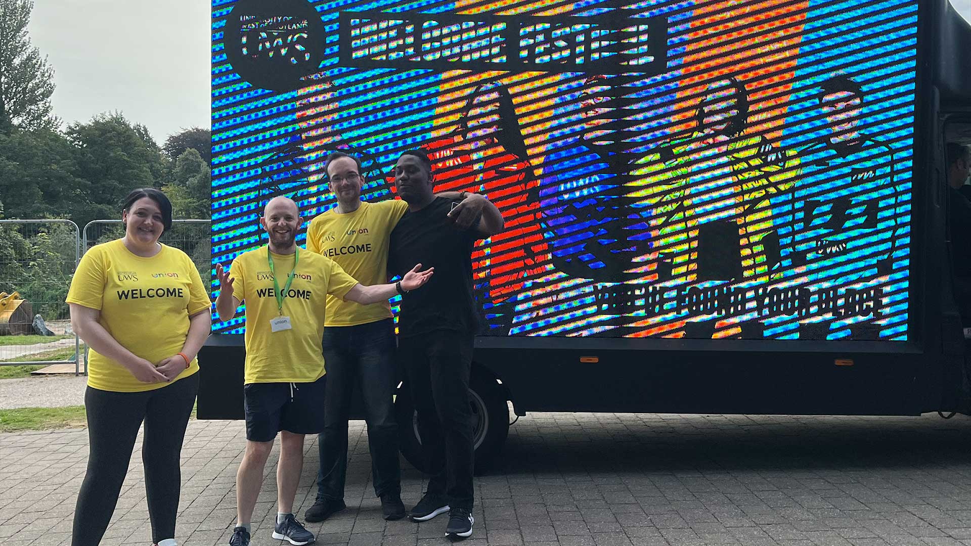 Volunteers posing in their welcome shirts