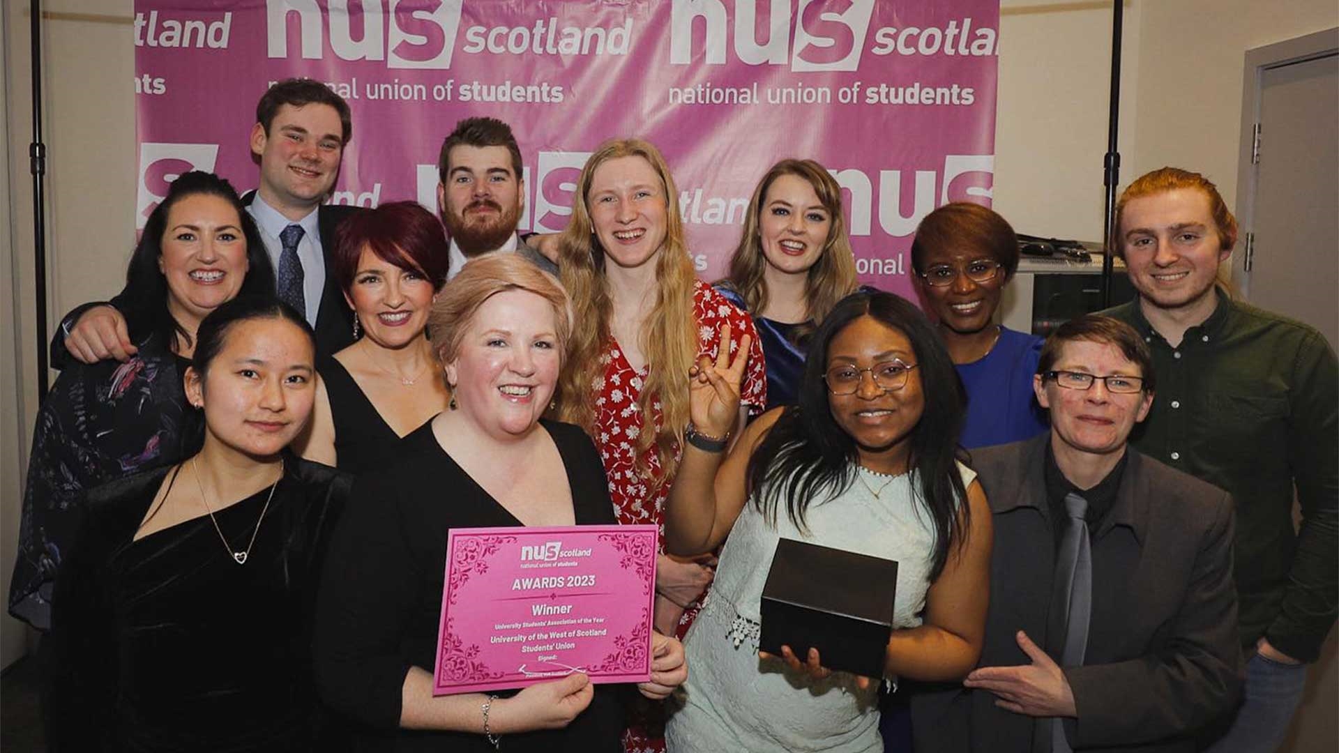 Union Staff posing at the NUS Scotland awards ceremony with a certificate
