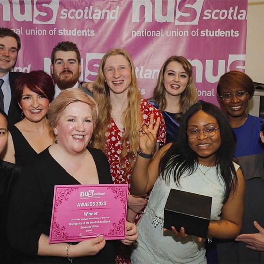 Union Staff posing at the NUS Scotland awards ceremony with a certificate